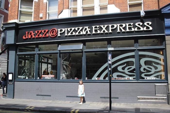 Bella in front of Pizza Express
