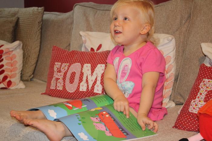 Sienna happy with new Peppa Pig book