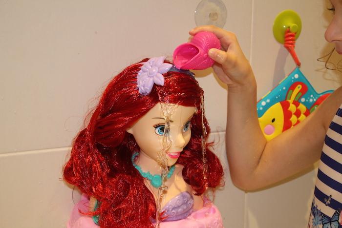 bella-pouring-water-on-ariel-styling-head-no-changes