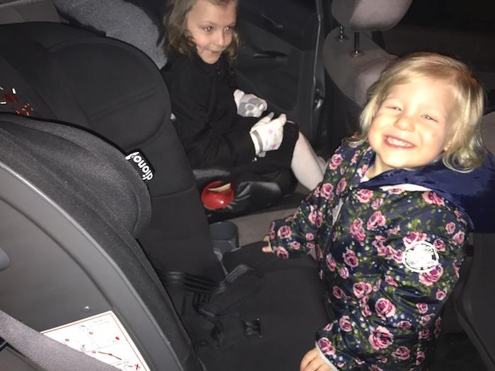 Sienna happy with her new car seat