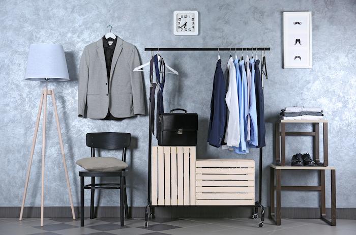 Clothing Essentials for Every Man’s Wardrobe. Casual stylish male clothes on hanger stand in room