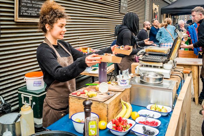 London, United Kingdom - April 30, 2016: Maltby Street Market in Bermondsey (located in railway arches, SE1, Rope Walk). Great artisan street food stalls and bars. Waffles stall