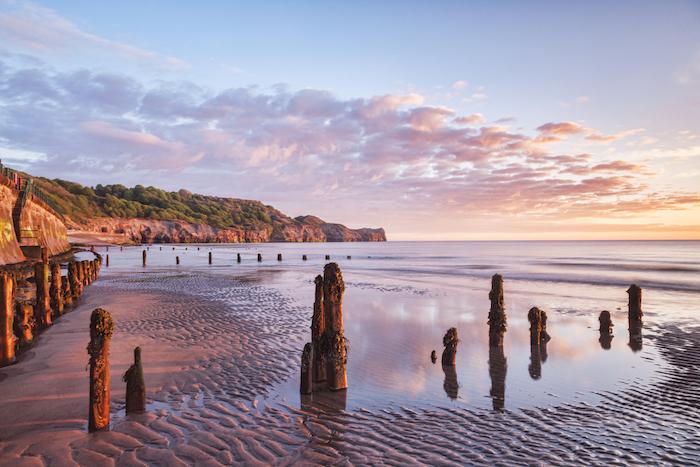 A beautiful sunrise at Sandsend Beach, Whitby, North Yorkshire, England, UK
