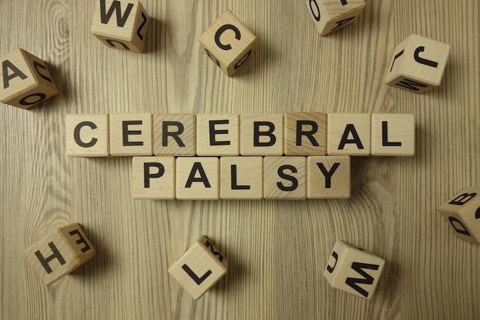 Text cerebral palsy from wooden blocks on desk