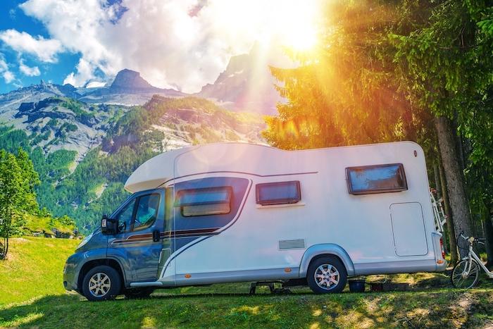 Camper Camping. Class B European Style Motorhome Caravan. Camper Van Trip. Summer RV Adventure.