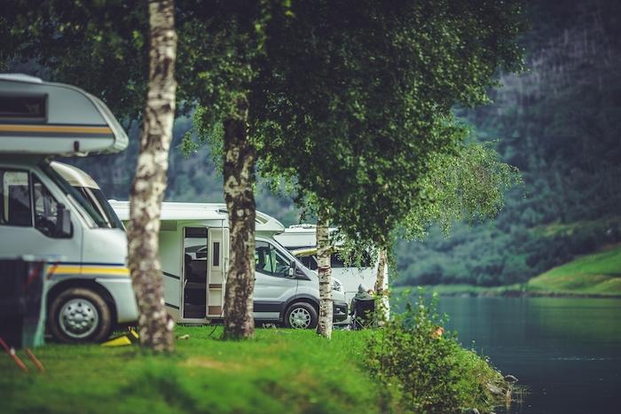 Scenic RV Park Camping. Lakefront Campsite. Vacation in Recreational Vehicle