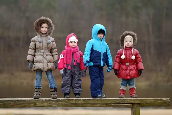 Four kids having fun on early spring