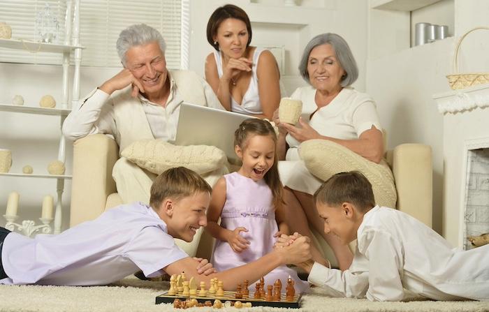 Happy family with kids with laptop