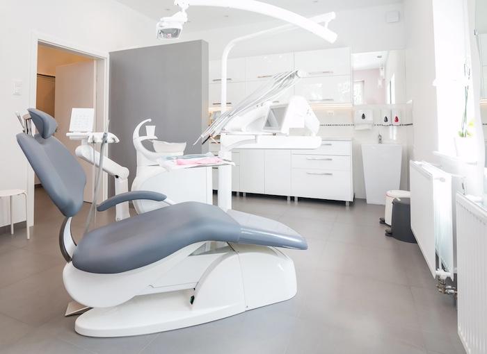 dentistry, medicine, medical equipment and stomatology concept - interior of new modern dental clinic office with chair