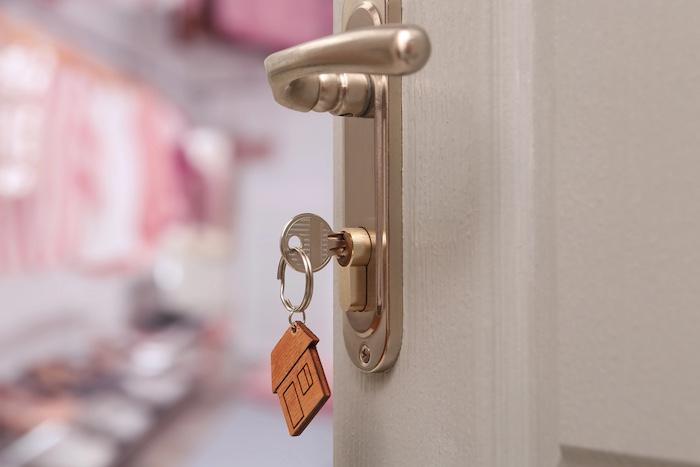 Closeup view of door with key open in room