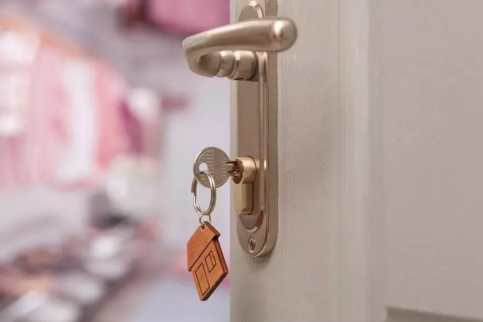 Closeup view of door with key open in room