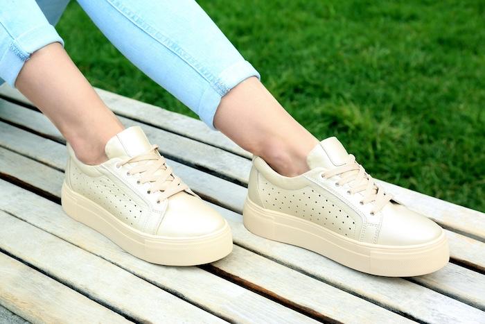 Woman wearing comfortable stylish shoes outdoors, closeup