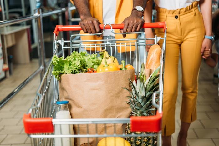Shopping trolley with food in supermarket