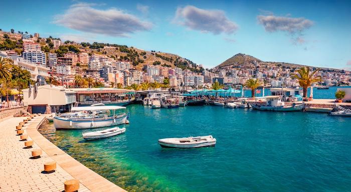 Perfect spring cityscape of Saranda port. Picturesque Ioninian seascape. Bright morning scene of Albania, Europe. Traveling concept background.